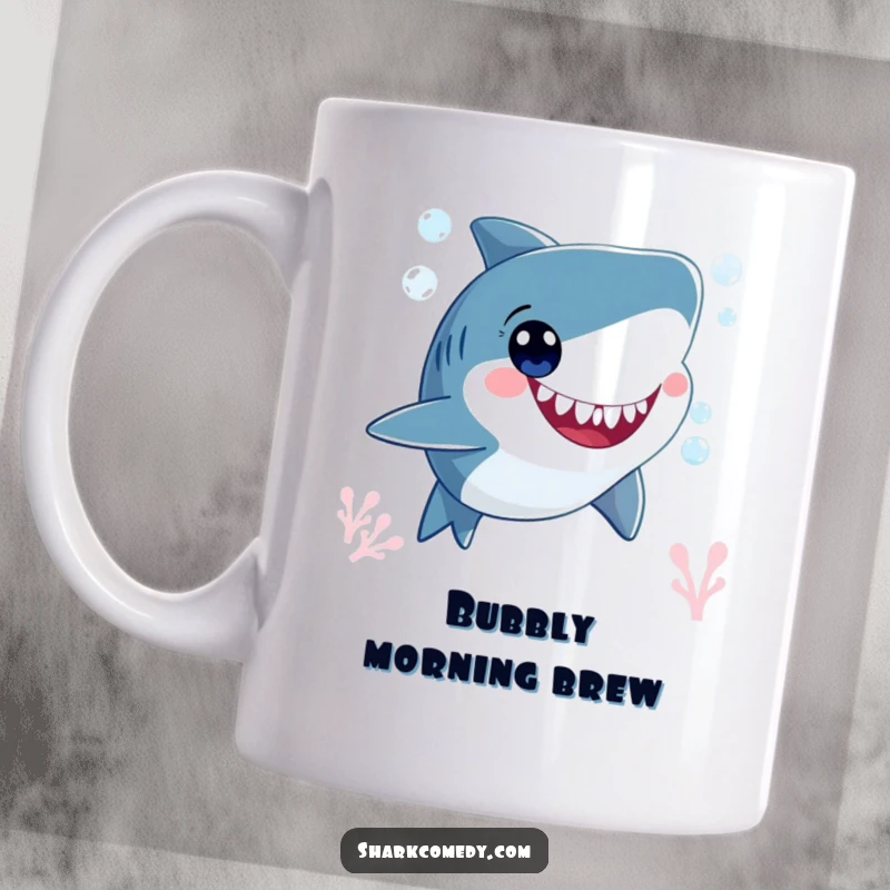 Funny smiling shark character, blowing bubbles underwater with wide, happy eyes, captured on a cheerful coffee mug.
