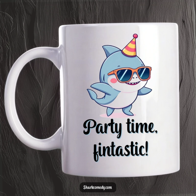Funny shark wearing oversized sunglasses and a tiny party hat, joyfully dancing with fins up on a ceramic mug.