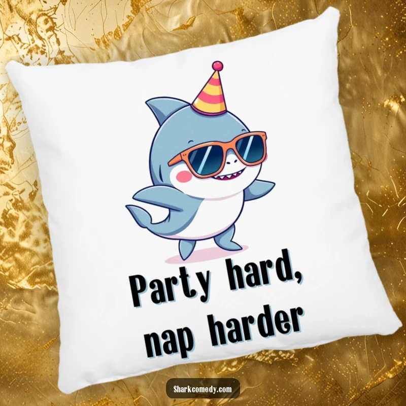 Funny shark wearing oversized sunglasses and a small party hat, dancing playfully on a soft, decorative pillow.