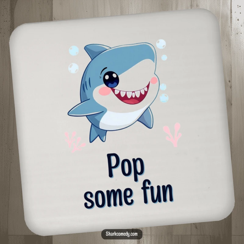 Funny smiling shark character, blowing bubbles underwater with wide, happy eyes, adorning a drink coaster for a touch of underwater humor.