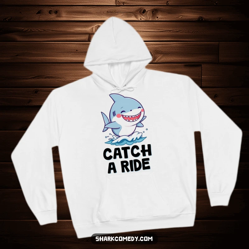 Funny kawaii shark with a silly grin surfing on a small wave, featured on a warm and cozy hoodie.
