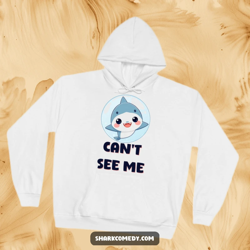 Funny kawaii shark hiding behind a big bubble, featured on a cozy hoodie, perfect for a playful and warm look.