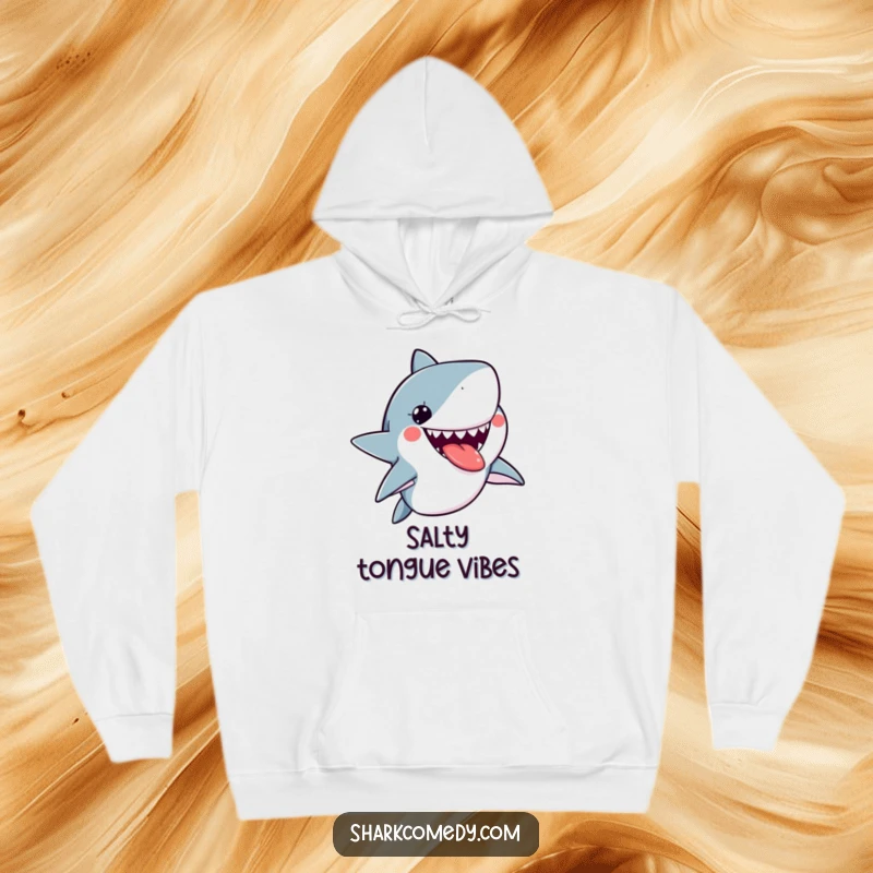 Funny kawaii shark hoodie showing a cute shark sticking its tongue out playfully, offering warmth and a cheeky grin.