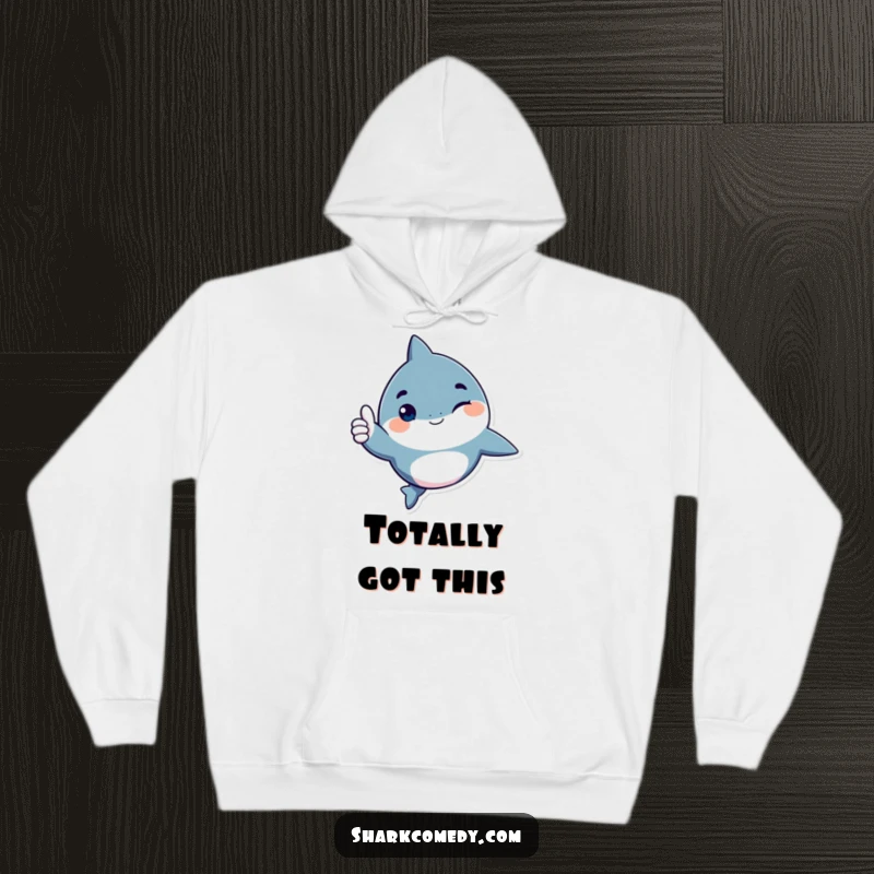 Funny shark character hoodie, giving a playful wink and a thumbs up, a warm and humorous design for spreading positivity.