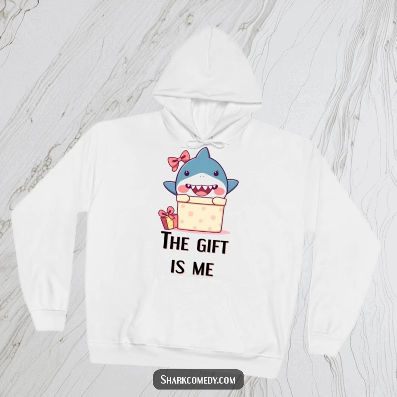 Comfortable hoodie featuring a funny kawaii shark peeking out of a gift box with a look of surprise, ideal for cozy humor.