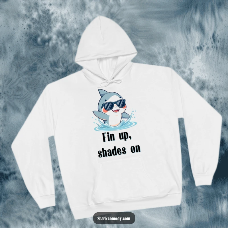 Funny Shark Sunglasses Hoodie featuring a stylish shark in shades, playfully splashing water, offering warmth and oceanic humor.