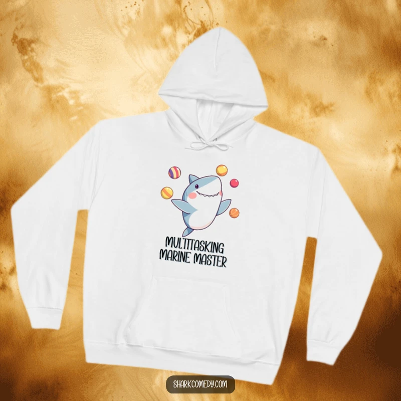 Funny hoodie design of a shark delightedly juggling colorful balls with its fins, showcasing impressive aquatic skills.