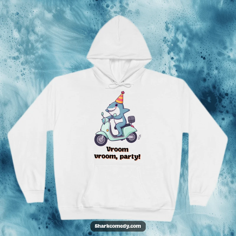 Funny shark hoodie, depicting a shark in a party hat zooming on a scooter, offering warmth and a dose of fun.