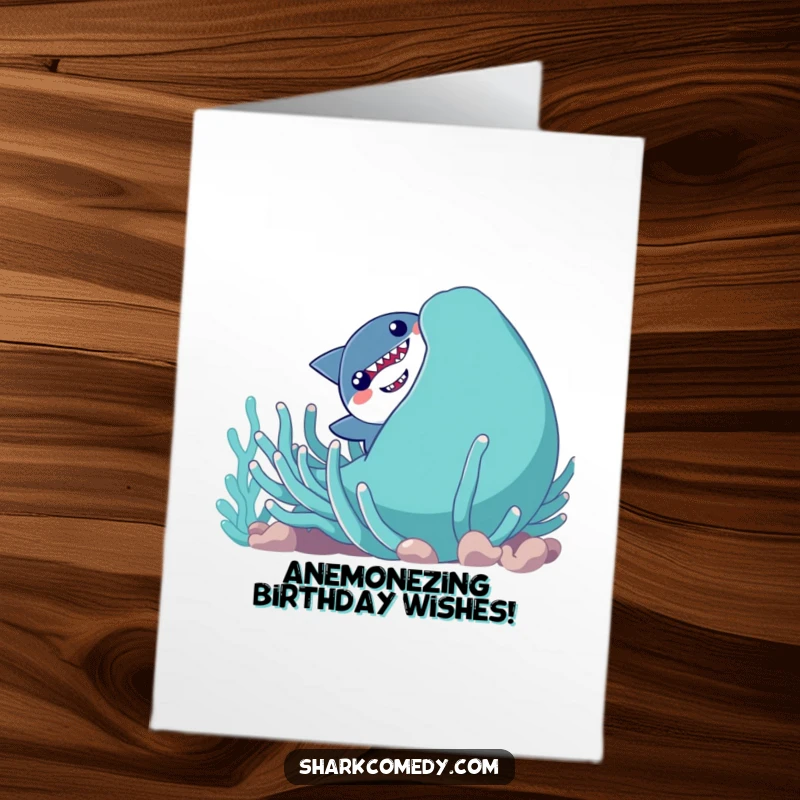 Funny Free Printable Birthday Card: Shy shark peeking from behind a giant smiling sea anemone, wishing a happy birthday with a giggle.