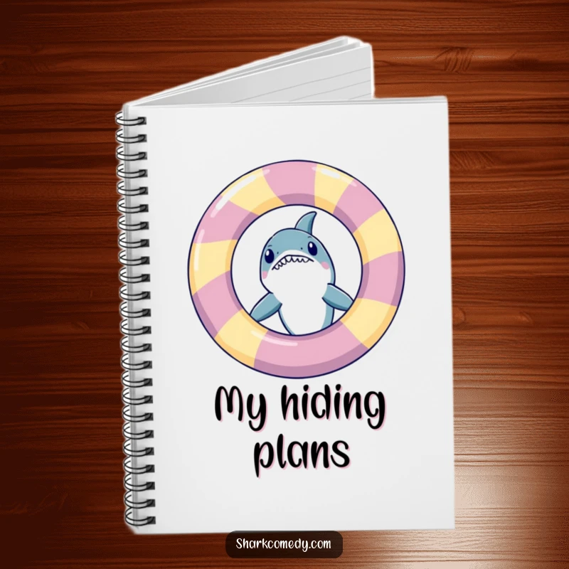 Funny shark peeking from an inflatable ring, featured on a notebook cover, perfect for jotting down ideas playfully.