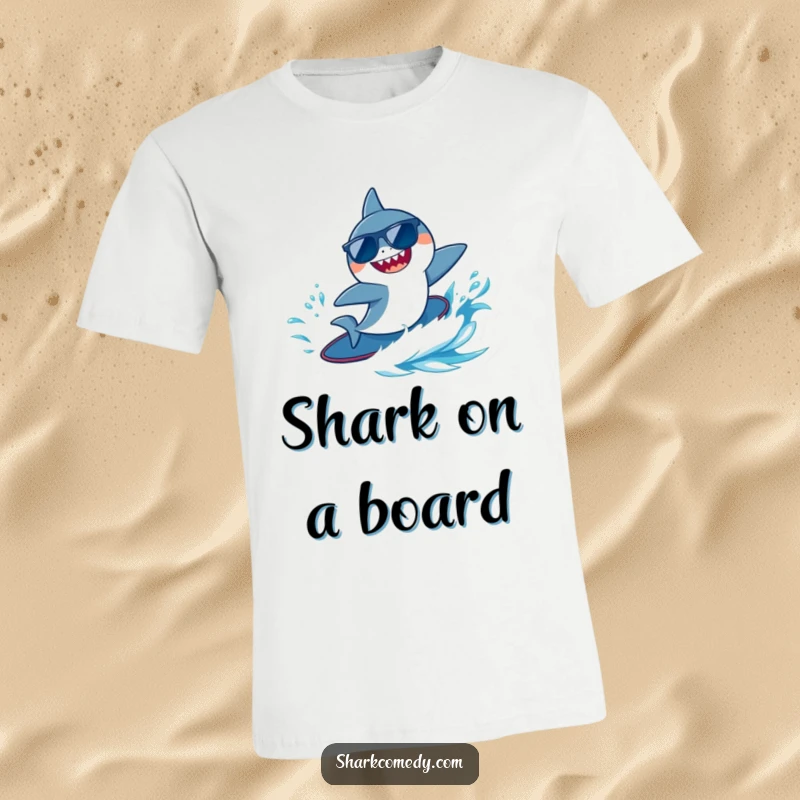 Funny tiny shark wearing sunglasses, joyfully surfing a blue wave, printed on a comfortable graphic tee.