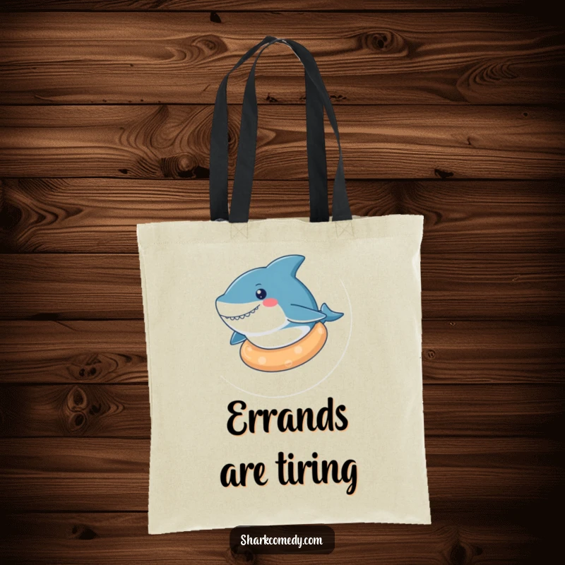 Funny kawaii shark tote bag with a cute shark relaxing on a rubber ring, perfect for a day of leisure and fun.