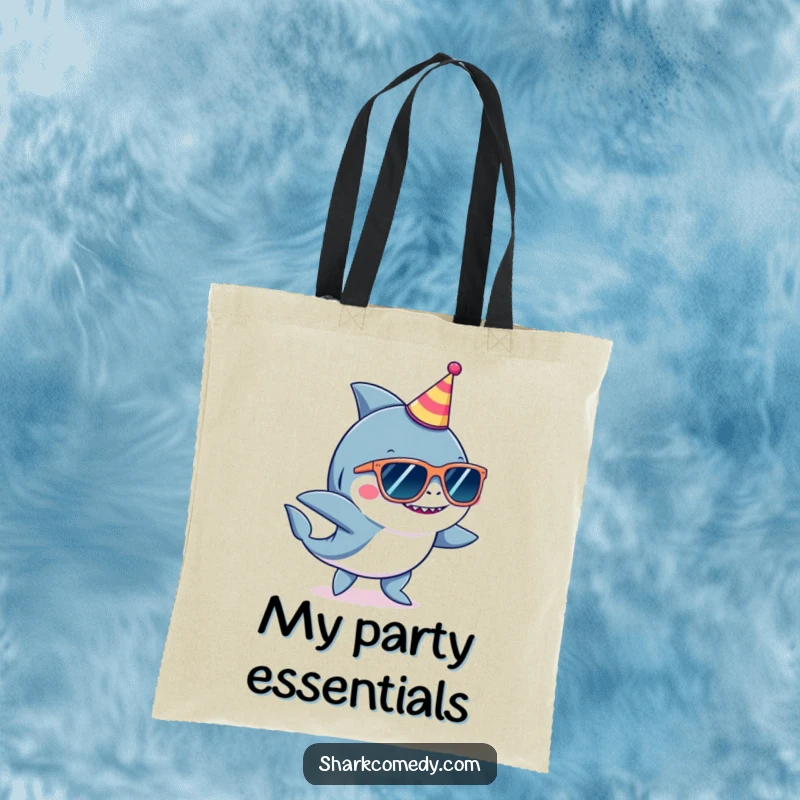Funny shark character wearing oversized sunglasses and a tiny party hat, dancing on a spacious and humorous tote bag.