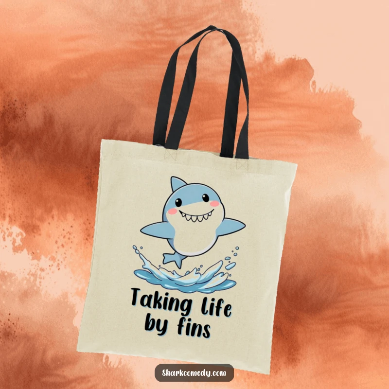 Funny tote bag depicting a small shark mid-leap out of water, showcasing a comical surprised expression and energetic vibe.